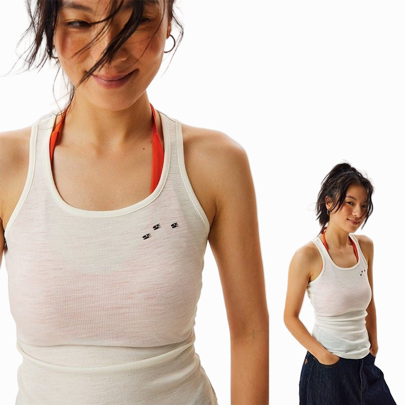 Woman wearing a white tank top with red straps, featuring COOLMAX technology on a light gray background.