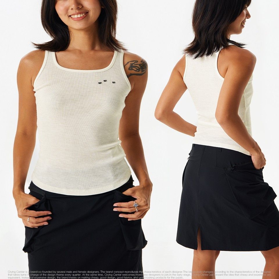 Woman wearing a white tank top and black skirt from front and back views on a white background
